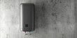 Modern Slim Black Electric Water Heater on the Concrete Wall