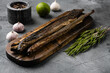 Smoked lamprey , on gray stone table background