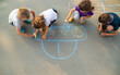 © yanadjan - children draw a car with chalk on the pavement. selective focus.