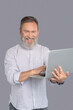 © zinkevych - Bearded man working with his gadget