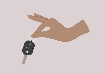 A rental service, a  hand holding a remote control vehicle key, a car-sharing concept