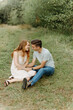 © Luke Liable/Stocksy - Couple laughing together on the ground