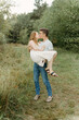 © Luke Liable/Stocksy - Man holding woman while kissing
