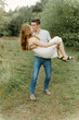 © Luke Liable/Stocksy - Man holding woman while kissing