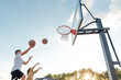 © Jessica Klaus/Stocksy - Brother and sister playing basketball together.