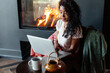 © Sergey Narevskih/Stocksy - Content black woman surfing internet