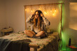 © Eloisa Ramos/Stocksy - Teenager relaxing at bedroom