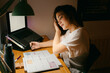 © Eloisa Ramos/Stocksy - Female student doing homework on her desk