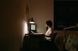 © Eloisa Ramos/Stocksy - Young woman studying at night