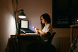 © Eloisa Ramos/Stocksy - Teen girl studying at night