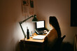 © Eloisa Ramos/Stocksy - Female studying at night with a laptop