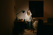 © Eloisa Ramos/Stocksy - Tired teenager girl studying at night