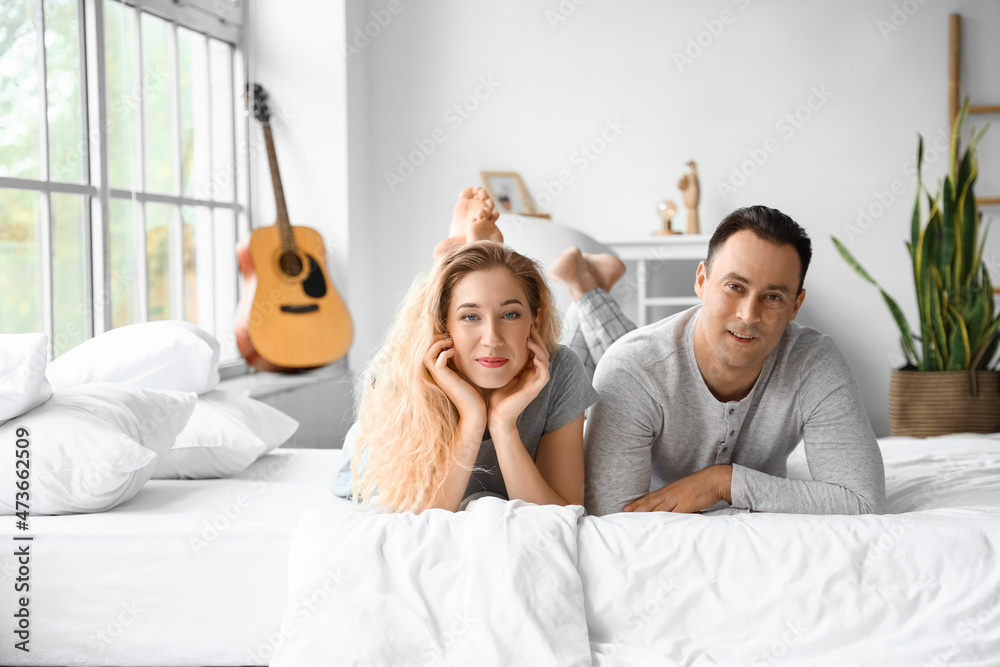 Happy couple spending time together at home