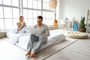 Wall Mural - Happy couple spending time together at home