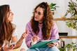 © kkgas/Stocksy - Woman listens to feedback on design