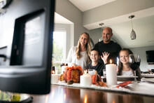 Thanksgiving: Family Waves To Relatives On Distanced Video Chat