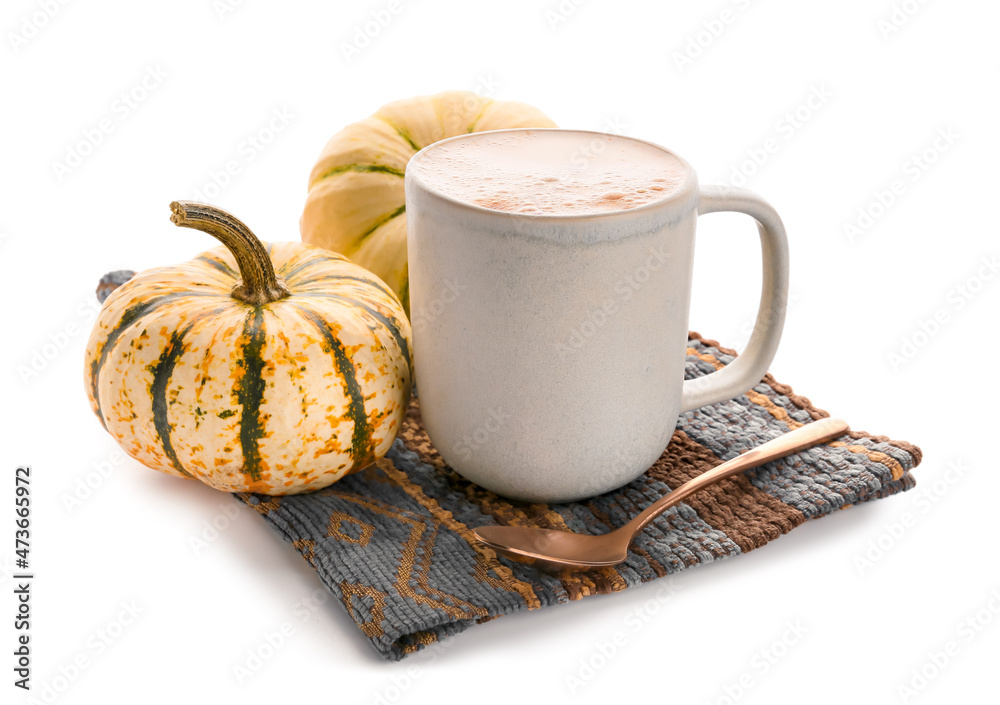 Cup of tasty pumpkin coffee on white background