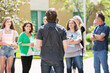 © Sean Locke/Stocksy - Tour: Rear View Of Guide Talking To Group Of Students And Parent