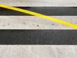 © Rene de Haan/Stocksy - yellow line crossing zebra crossing