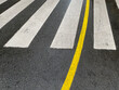 © Rene de Haan/Stocksy - zebra crossing with yellow line
