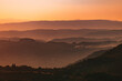 © Dimitrije Tanaskovic/Stocksy - Layers Of Hills During Sunset