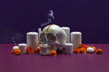 Skull With Flowers And Smoke From Candles