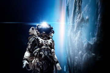 Wall Mural - astronaut walking on an unexplored planet