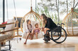 © Santi Nuñez/Stocksy - Disabled mom speaks with her daughters