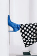 © Sergey Filimonov/Stocksy - Leg of woman in blue shoe - Fashion detail