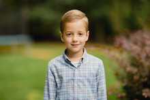 Portrait Of A Young Boy In A Button Up Shirt