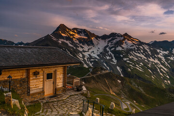 Poster - Chalet on Mountain Top Overlooking Grossglockner Alpine Road and Alps at Sunrise