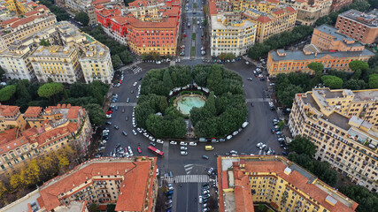 Wall Mural - Aerial drone photo of iconic Piazza Mazzini or Mazzini square in the centre of Prati with beautiful Roman building architecture and small fountain, Rome, Italy