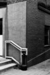 © Cameron Whitman/Stocksy - Stucco and brick building corner