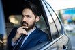 © Milana - A handsome young businessman is driving in the car