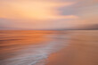 © Maryanne Gobble/Stocksy - Sunset Blur of the Beach and Ocean