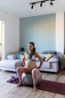 © Santi Nuñez/Stocksy - Pregnant Woman Sitting On Birthing Ball