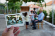 © Nasos Zovoilis/Stocksy - Man's hand holding instant photo