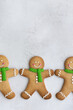 © Ruth Black/Stocksy - Gingerbread men in a row