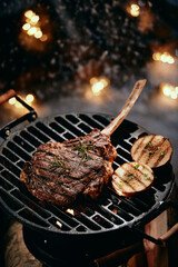 Wall Mural - Tomahawk steak preparing on grill