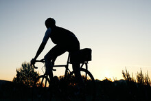 Silhouette Male Cyclist At Sun Rise 