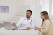 © New Africa - Young woman having appointment in gynecologist office