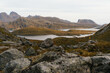 © Kike Arnaiz/Stocksy - Calm lake amidst rocky cliffs