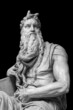 Figure of the biblical prophet Moses isolated on black background. Michelangelo sculpture on the tomb of Pope Julius II
