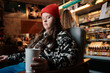 © Clique Images/Stocksy - Young Woman In Cafe