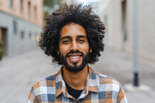 Young Man With Afro Hairstyle Smiling