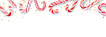 Red And White Striped Candy Cane Sticks Frame On White Background.
