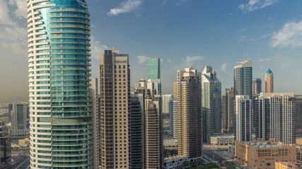  Dubai's business bay towers aerial morning timelapse. Rooftop view of some skyscrapers