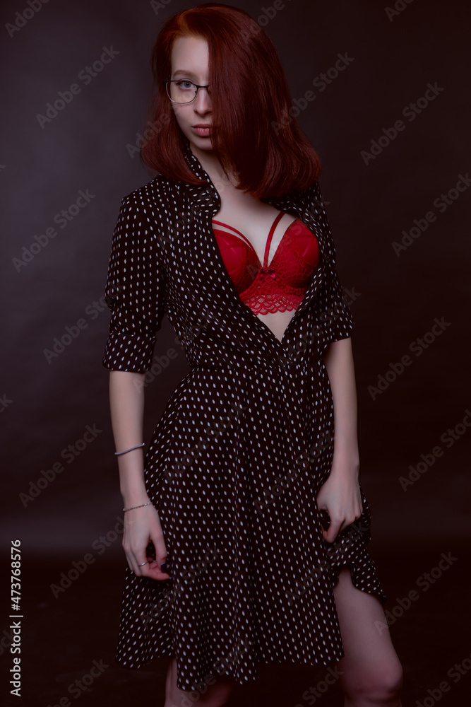 Sexy gorgeous girl posing in an unbuttoned dress and underwear Stock