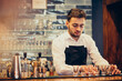 © Petro - Handsome bartender making drinking and cocktails at a counter