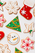 Pattern Of Various Christmas Cookies Flat Laid Against White Background